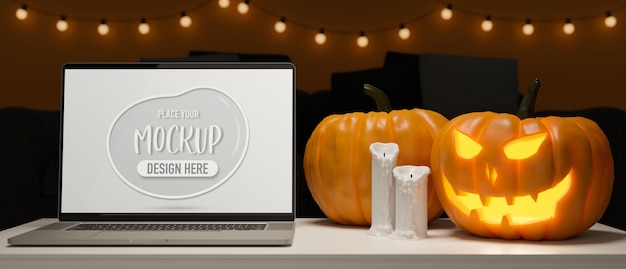 PSD ordenador portátil con pantalla de maqueta en la mesa con lámparas de calabaza y velas decoradas en concepto de halloween 3d rendering