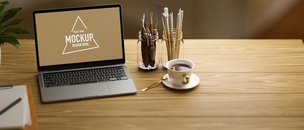 Ordinateur portable avec écran de maquette sur table en bois avec outils de peinture et tasse à café, rendu 3D, illustration 3D