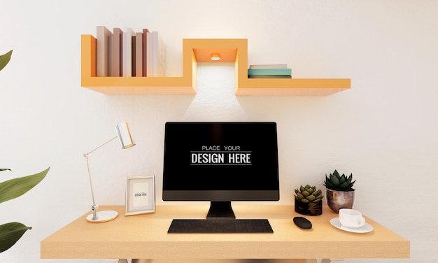 Ordinateur sur table dans l'espace de travail MOCKUP