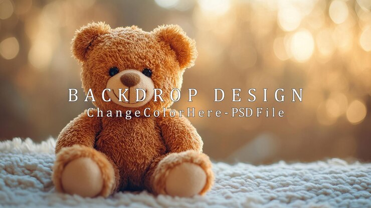 PSD un ours en peluche assis sur une couverture blanche