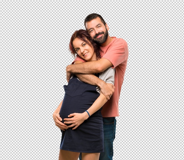 Paare mit dem umarmen der schwangeren frau