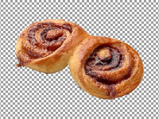 Pãezinhos de canela assados frescos com um esmalte marrom em um fundo transparente