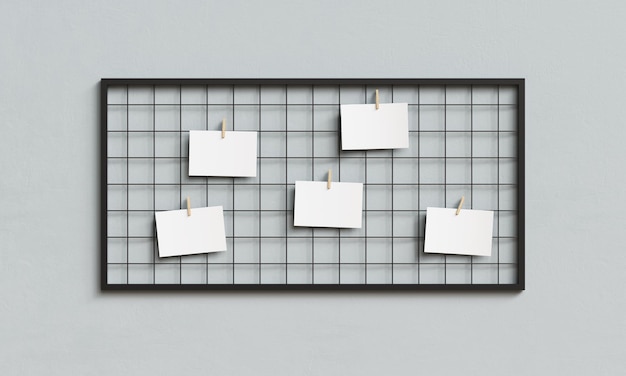 Papier blanc suspendu sur un tableau à grille métallique avec une pince en bois Mock up Rendering 3D