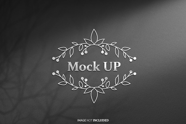 papper shadow logo in lamina nera e argento mockup psd
