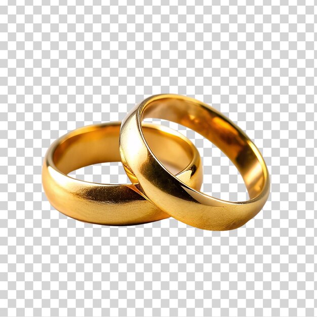 Un par de anillos de bodas de oro en un fondo transparente