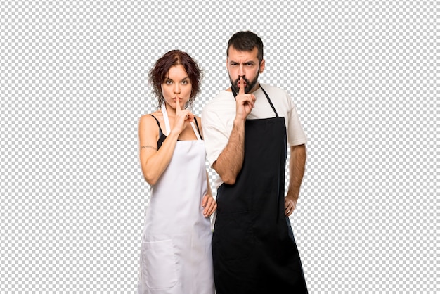 PSD par de cocineros mostrando un signo de silencio gesto poniendo el dedo en la boca
