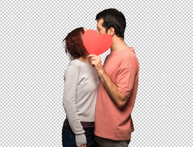 Pareja en el día de San Valentín con un símbolo de corazón y besos