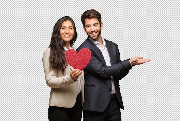 Pareja joven en el día de san valentín con algo con la mano