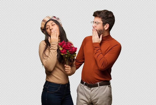 Pareja joven en dia de san valentin cansada y con mucho sueño