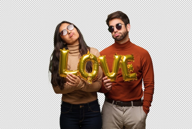 Pareja joven en el día de San Valentín cansado y aburrido