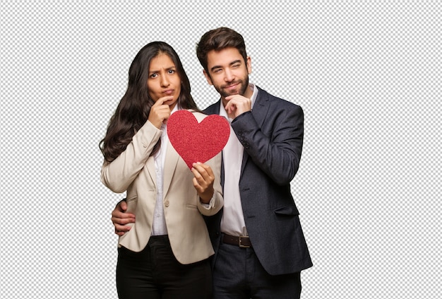 Pareja joven en día de san valentín dudando y confundida.