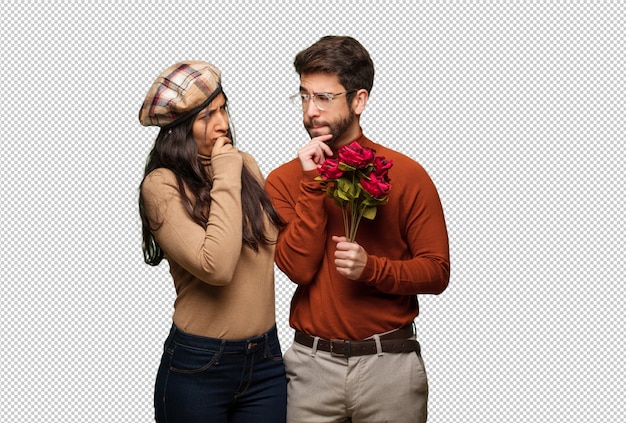 Pareja joven en día de san valentín dudando y confundida.