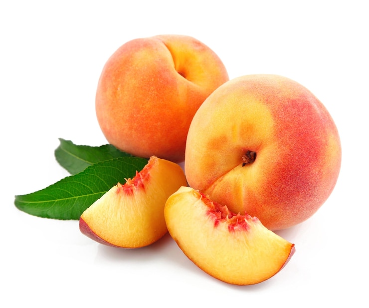 PSD peaches are on a white background with a green leaf