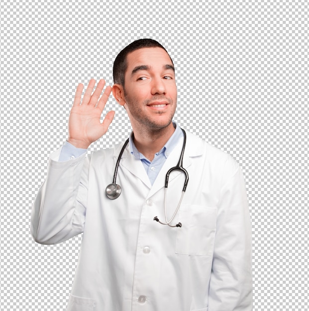 Pensativo joven doctor tratando de escuchar