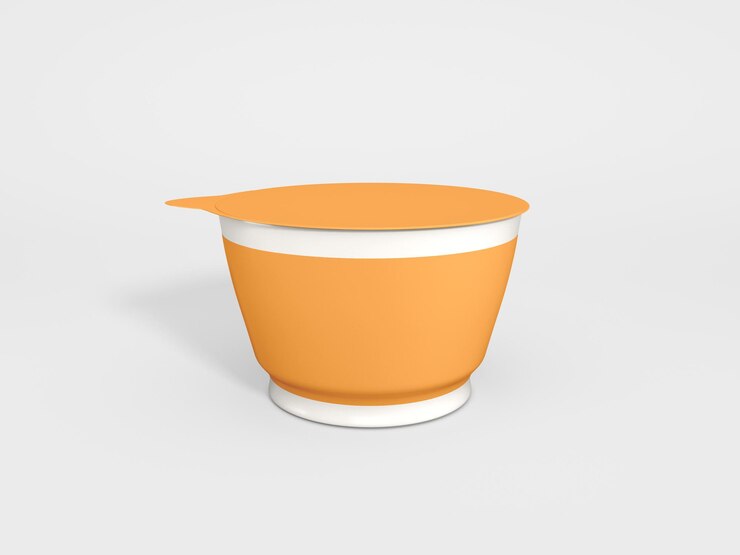 un pequeño tazón naranja con un mango blanco y una tapa blanca