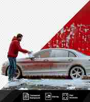 PSD perfil aislado de hombre limpiando espuma con servilleta en el coche estacionado frente a la pared roja con pantalones vaqueros azules png