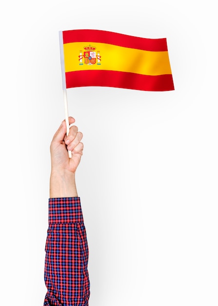 Personne agitant le drapeau du royaume d&#39;Espagne