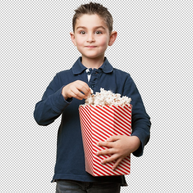 Petit enfant mangeant des popcorns