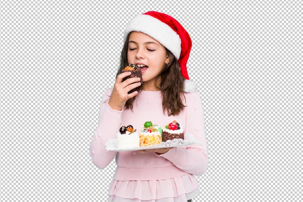 Petite Fille Tenant Des Bonbons Célébrant Le Jour De Noël