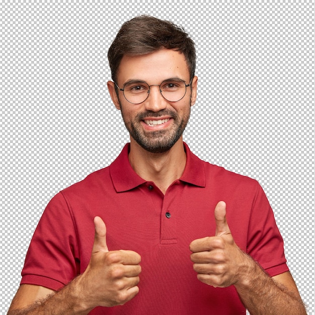 Photo d'un jeune homme beardé attrayant avec une expression affectueuse fait un geste d'accord avec les deux mains aime quelque chose vêtu d'un t-shirt décontracté rouge pose contre le mur blanc gestes à l'intérieur