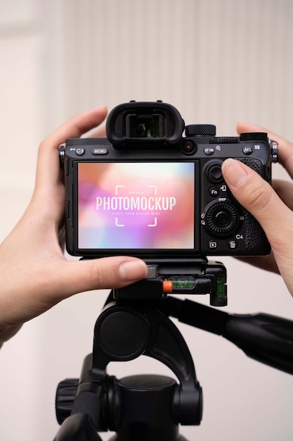 Photographie tenant un appareil photo