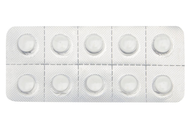 Piatto di pillole su uno sfondo vuoto