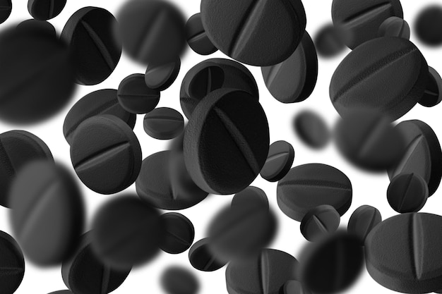 Pílulas ou cápsulas pretas Carvão ativado em fundo transparente isolado