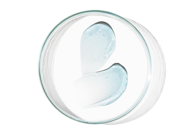 Placa de Petri con una gota y una mancha de gel transparente o suero sobre un fondo vacío