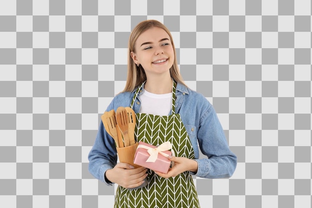 PNG 8 de marzo Niña con un delantal con un juego de madera de utensilios de cocina aislados sobre un fondo blanco