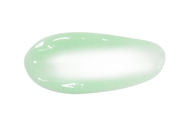 Un poco de crema fresca verde claro o mascarilla facial de pepino Con gránulos y motas Sobre un fondo en blanco PNG