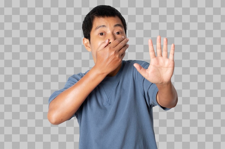 PSD portrait of young man covering mouth by hand and open hand doing stop sign