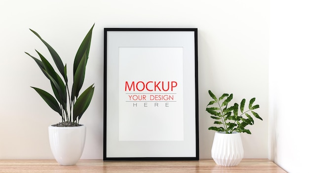 Poster Frame Mockup an der Wand mit Pflanze