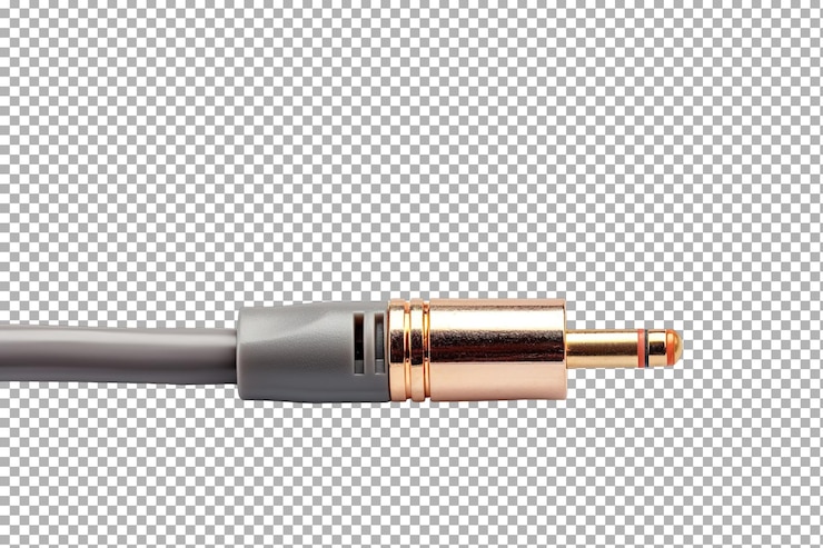 PSD un primer plano de un conector de jack de audio dorado descansando en un cable gris contra un fondo blanco limpio