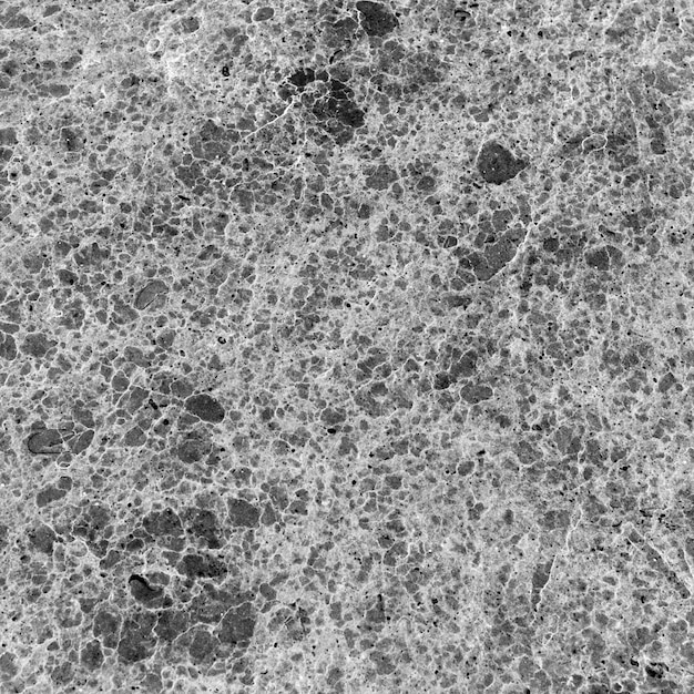 Un primer plano de una superficie de piedra de granito desgastada