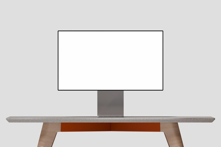 PSD pro display desktop mockup with blank screen on a modern wooden table