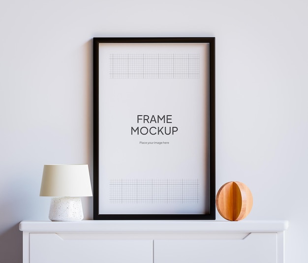 PSD Photo Frame Mockup sul tavolo con legno e luci Soggiorno decorazione parete bianca