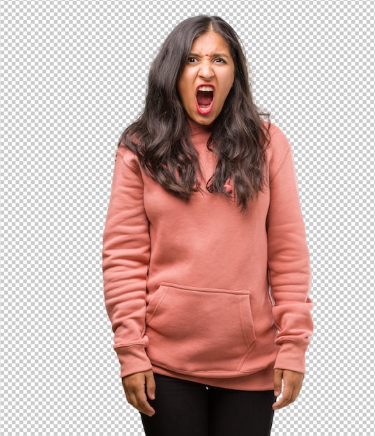 Retrato de aptidão jovem indiana gritando com raiva, expressão de loucura e instabilidade mental, boca aberta e olhos entreabertos, conceito de loucura