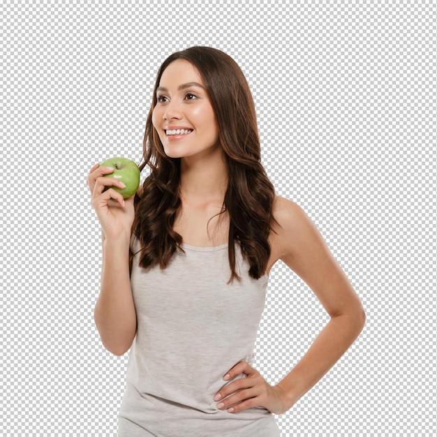 Retrato de mulher saudável com cabelos castanhos longos de pé isolado sobre maçã verde suculenta de sabor branco