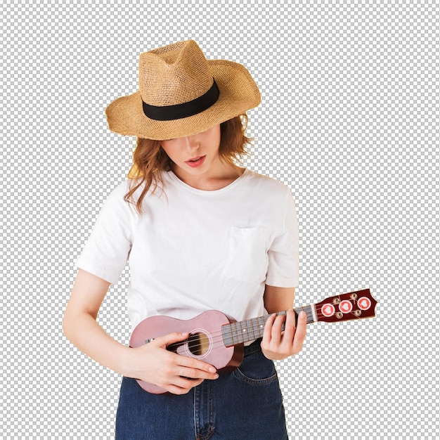 Retrato de uma linda senhora com um chapéu de palha de pé com uma pequena guitarra e tocando-a em fundo rosa