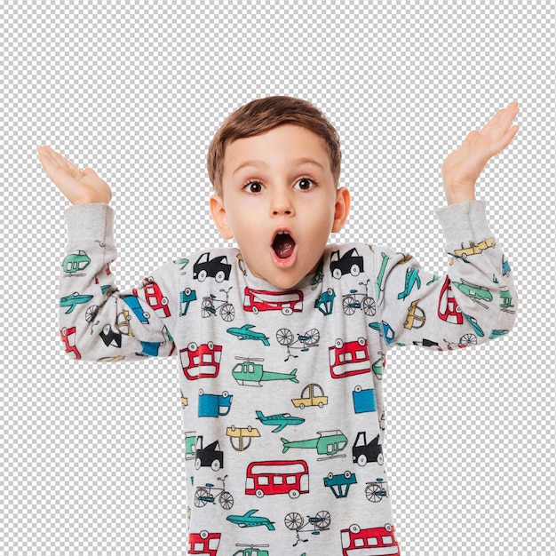 Retrato de un niño pequeño sorprendido de pie y encogiéndose de hombros