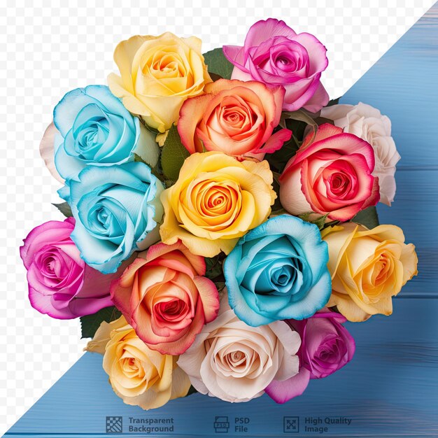 PSD roses multicolores disposées sur une table en bois bleue capturée d'en haut