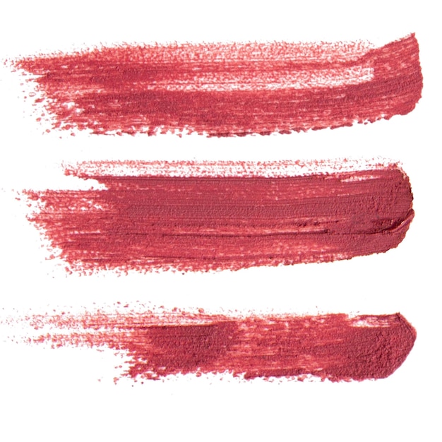 Un rouge à lèvres liquide rose mat sur un fond vide