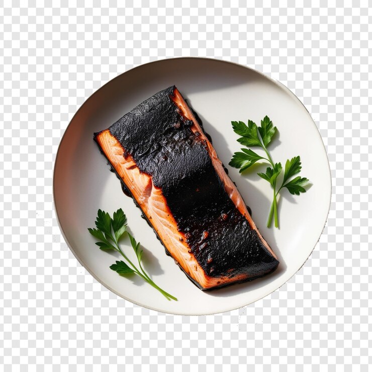 PSD salmón a la parrilla con piel carbonizada en un plato con guarnición de perejil