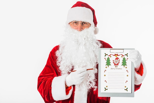 Santa tenendo appunti con wishlist