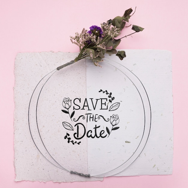 Save the date mock-up on paper with dried flowers