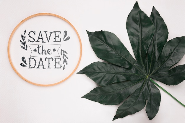 Save the date mock-up with big leaf