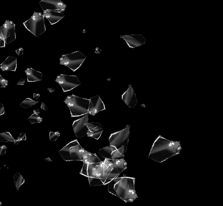 PSD shattered glass fragments on a black backdrop