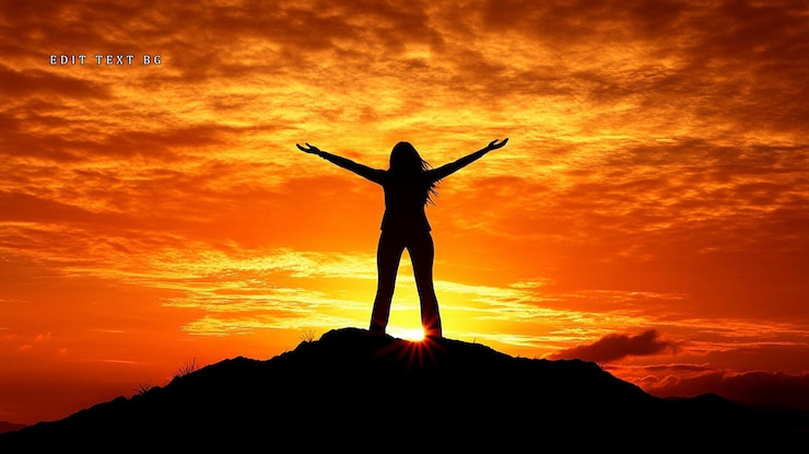 PSD silhouette of a woman with arms outstretched standing on a hilltop at sunset