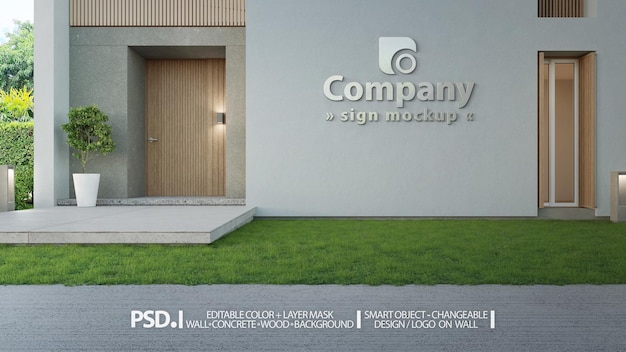 PSD sinal da empresa e maquete psd do logotipo na fachada da parede de concreto da entrada do edifício moderno