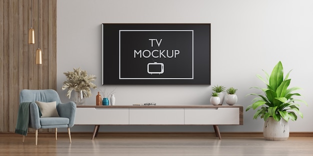 Smart TV na parede branca da sala de estar com poltrona renderização em 3D